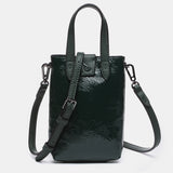 Patent leather handbag in green