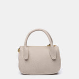 Kleine Handtasche aus recycelten Materialien in Beige.