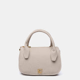 Kleine Handtasche aus recycelten Materialien in Beige.