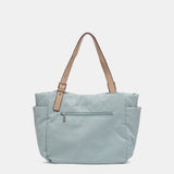 Shopper-Tasche aus recycelten und gepolsterten Materialien in Blau.