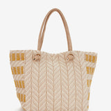 Strandtasche mit gelbem Muster.