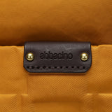 Bolso multifuncional en nylon reciclado ámbar