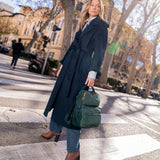 Green backpack made from recycled materials.