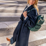 Green backpack made from recycled materials.