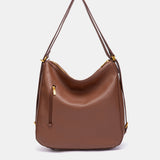 Bolso multifuncional trenzado en cognac