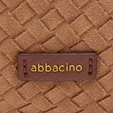 Bolso multifuncional trenzado en cognac