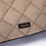 Taupe quilted handbag.