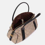 Taupe quilted handbag.