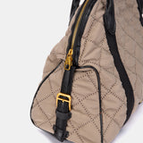 Taupe quilted handbag.