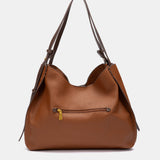 Bolso de hombro con borla cognac