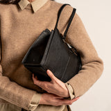 Black handbag.