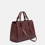 Burgundy handbag.
