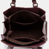 Burgundy handbag.
