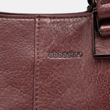 Burgundy handbag.