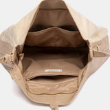 Beiger Schultertasche mit Quaste.