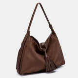 Bolso de hombro con borla marrón