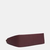 Burgundy shoulder bag made from recycled materials.