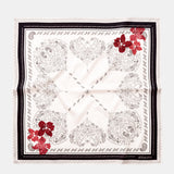Silk bandana with black and white paisley print.