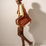 Orange macramé shoulder bag